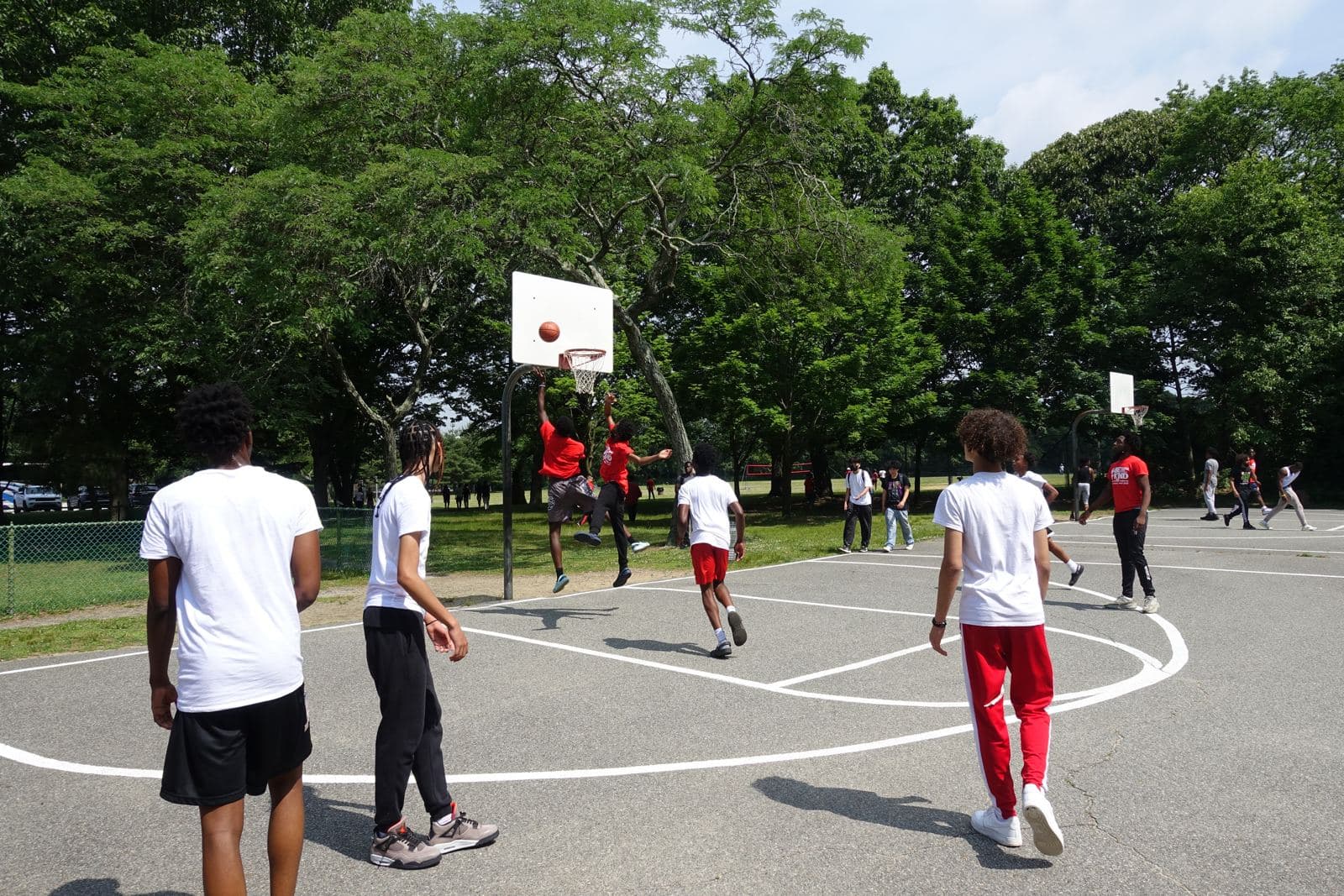 Students on a basketball court during a school trip