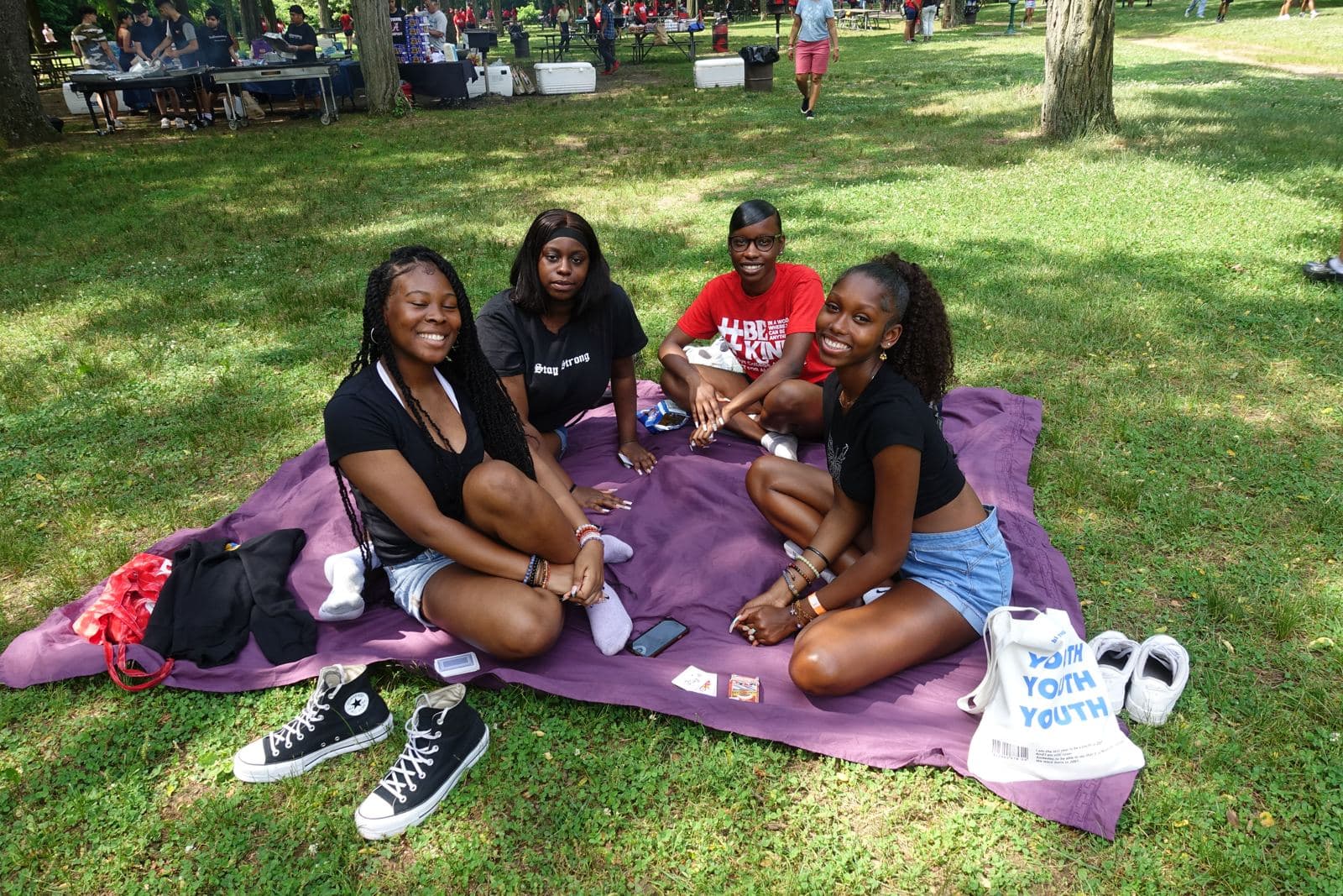 Students relaxing together on a picnic blanket