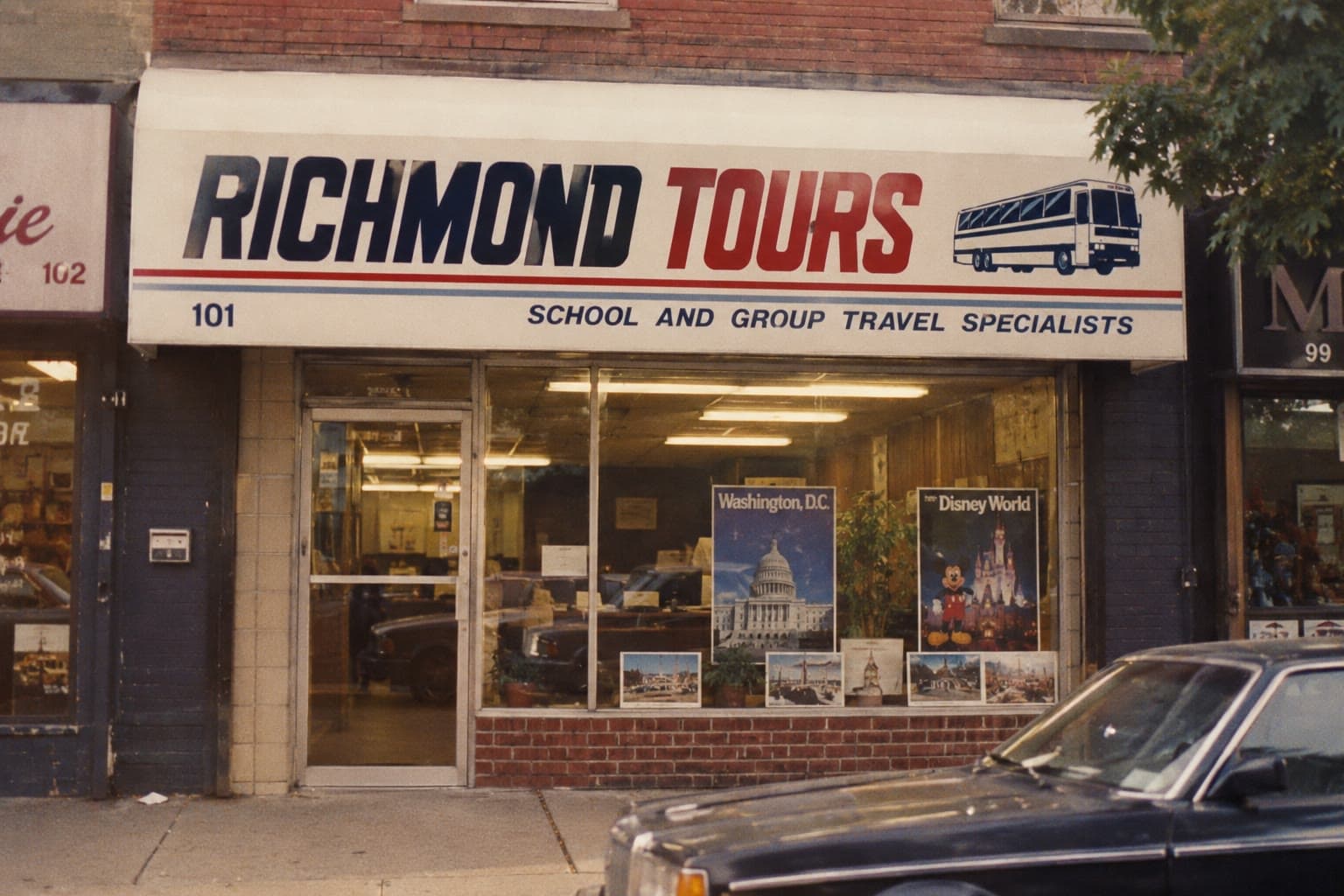 The original Richmond Tours storefront with its red awning and 1980s cars parked out front